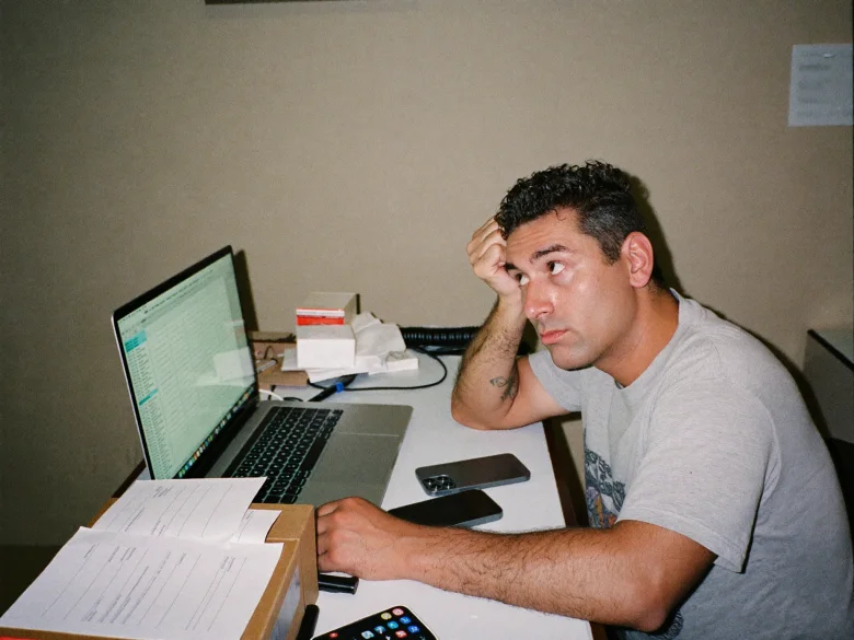 Restaurant owner looking overwhelmed late at night